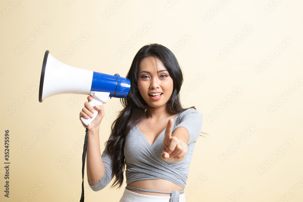 Beautiful young Asian woman announce with megaphone. Beautiful young Asian woman announce with megaphone.