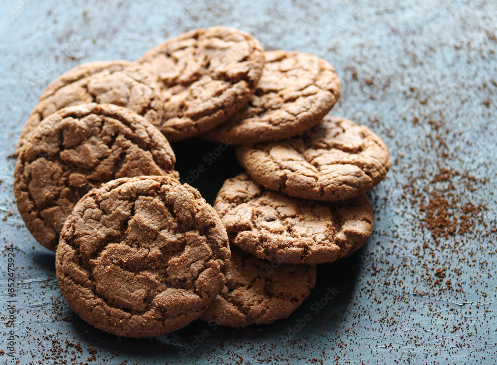 chocolate oatmeal cookies on a black background close up chocolate oatmeal cookies on a black background close up