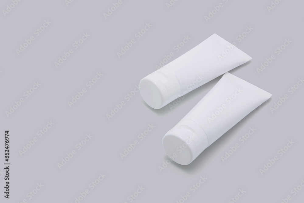 Cosmetic tube isolated on white background, mockup package of lotion or cream, product beauty and makeup, treatment skin care or acne, packaging or container, health and medicine template. Cosmetic tube isolated on white background, mockup package of lotion or cream, product beauty and makeup, treatment skin care or acne, packaging or container, health and medicine template.