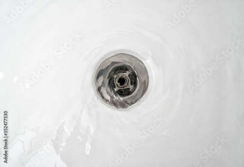 Water drains into the sink in the bathroom.