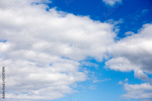 Fototapeta Naklejka Na Ścianę i Meble -  White fluffy clouds in blue sky in summer. Background with cloud