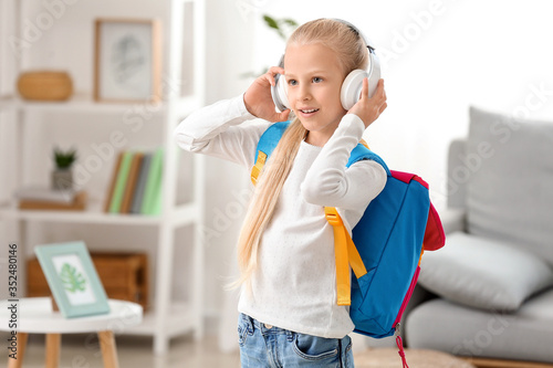 Cute little schoolgirl at home