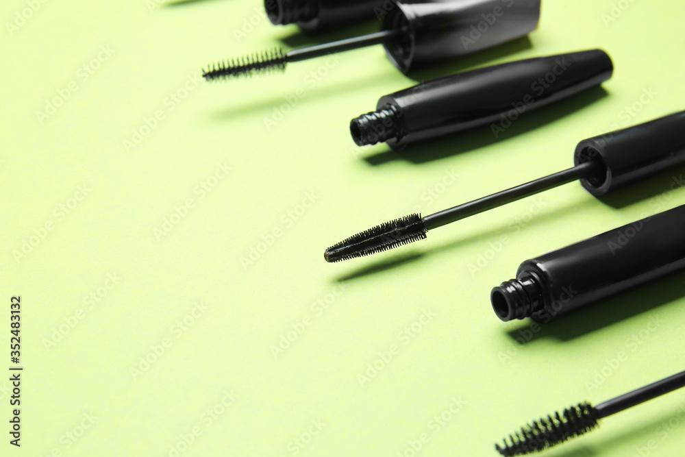 Black mascara on color background Black mascara on color background