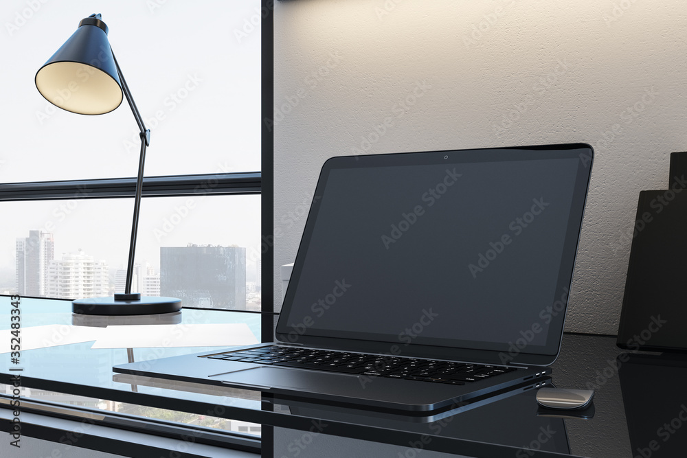 Designer desktop with empty black laptop screen Designer desktop with empty black laptop screen