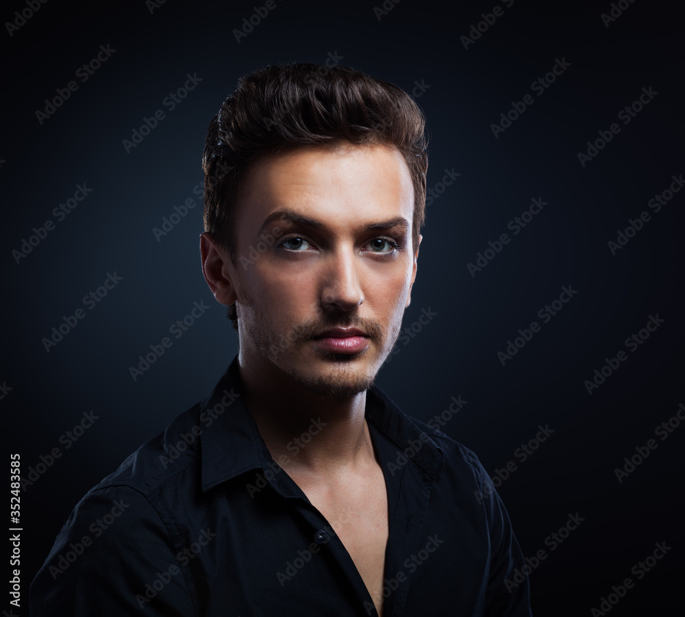 Young man's portrait. Close-up face. black background Young man's portrait. Close-up face. black background