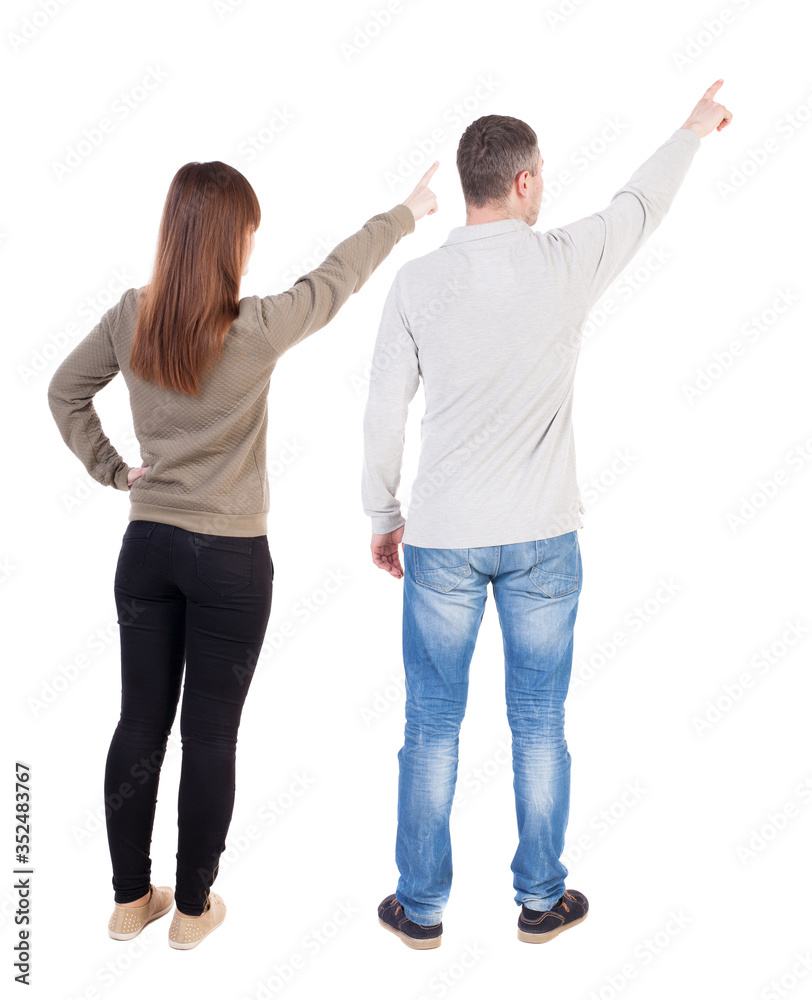 Back view of couple in sweater with mobile phone. Back view of couple in sweater with mobile phone.