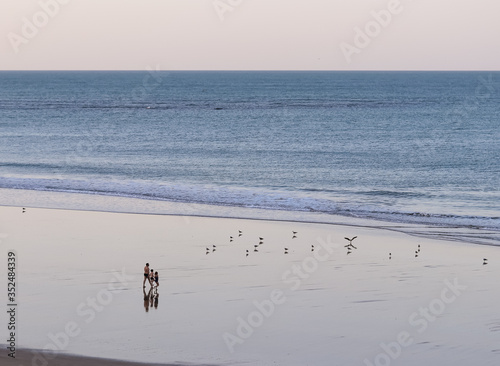 family on the beach at dawn