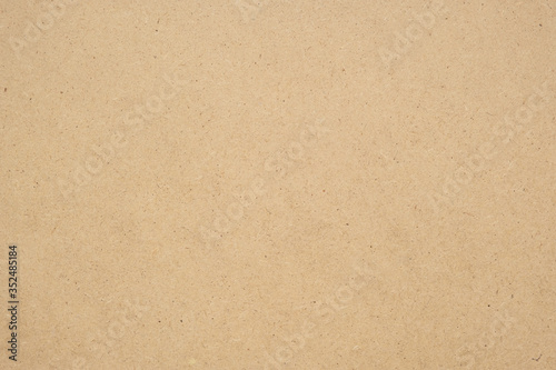 Texture of brown craft paper or kraft paper background.
