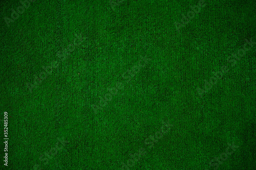 Green imitation grass material is for carpet, flooring, wall and sports stadiums.  Good for indoor and outdoor usage.  Durability, decoration, objects, background and textures.