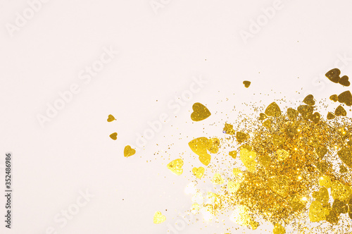 Vászonkép Gold glitter hearts on light gray background for your design