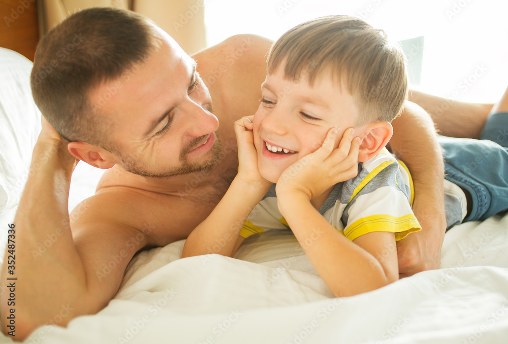 Happy Father's Day. Day and son playing, hugging, smiling. Happy Father's Day. Day and son playing, hugging, smiling.