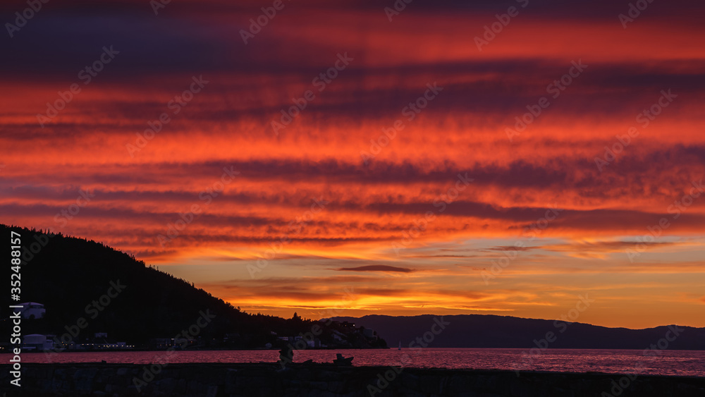 Dramatic red sunset sky in the sea