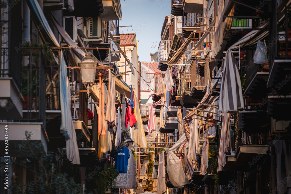 CEFALU, ITALY - October 02, 2019: Old town street with balconies and clothes