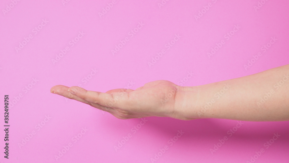 empty hand on pink background.