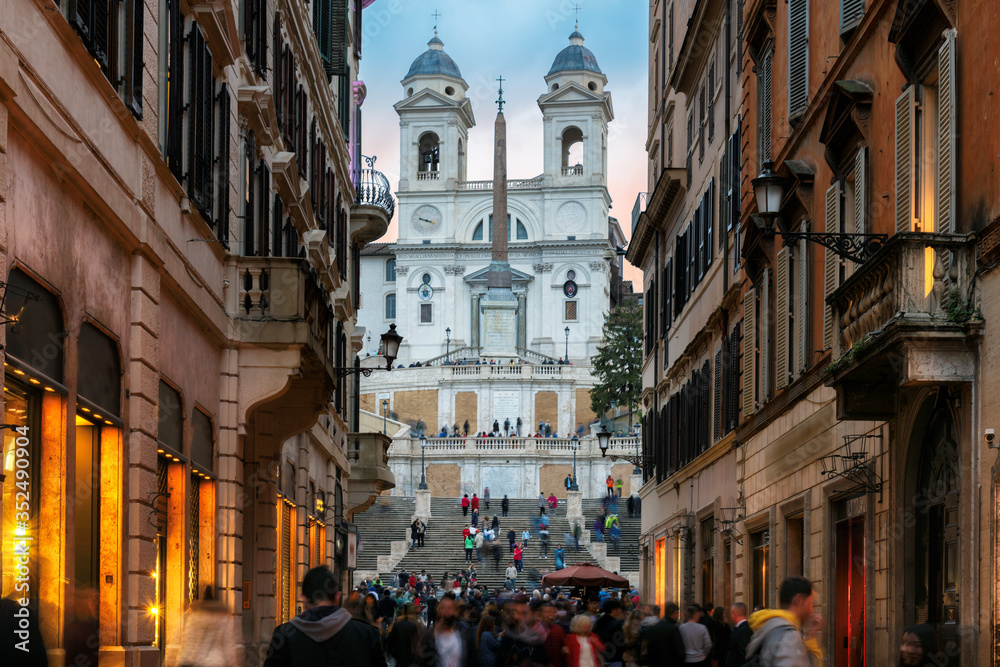 Old cozy street near Spanish Steps in evening in Rome, Italy.  Night cityscape of Rome. 