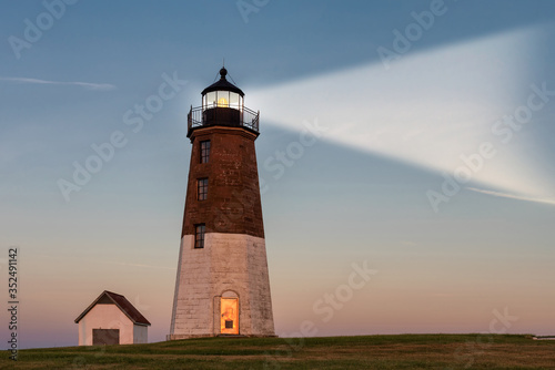 Lighthouse beam at sunset. Point Judith lighthouse  Rhode Island  USA