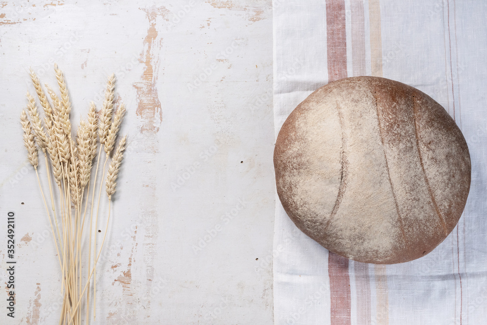 Fresh bread on the rustic white table flat lay background with copy space. Fresh bread on the rustic white table flat lay background with copy space.