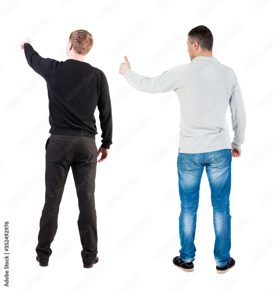 Back view of two man in sweater pointing. Back view of two man in sweater pointing.