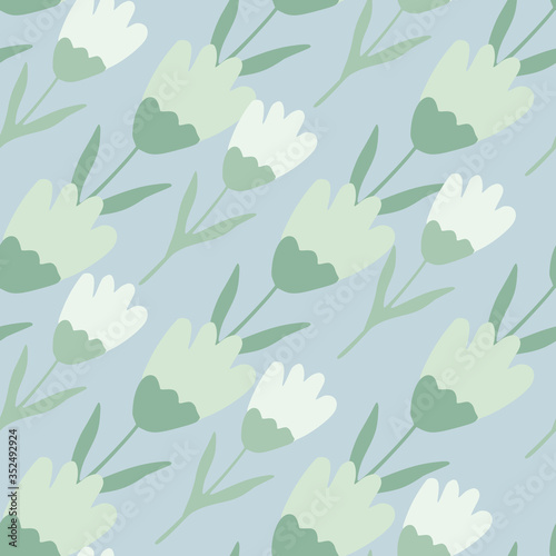 Cute tulip seamless pattern in doodle style on blue background. Floral backdrop. Spring flower wallpaper.