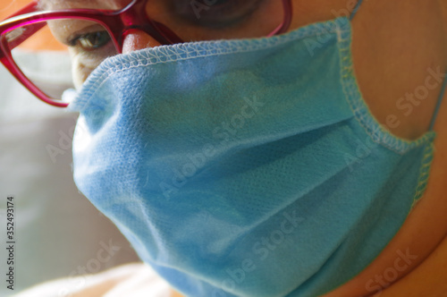 Woman face in medical protective mask