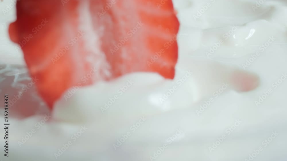 Fresh strawberries cut in half dipped in yogurt. Organic ripe strawberry. Close up Fresh strawberries cut in half dipped in yogurt. Organic ripe strawberry. Close up