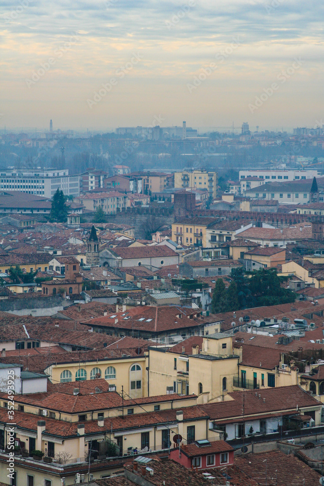 interesting view of verona from above with the bell towers and houses in the background
