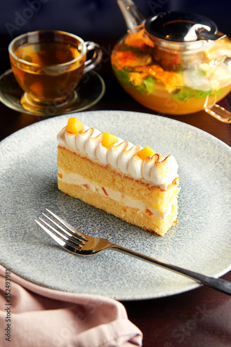 Piece of cake with pineapple and whipped cream.