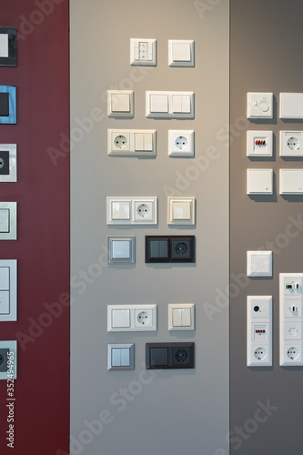 examples of wall switches and sockets in a light store © Iglenas