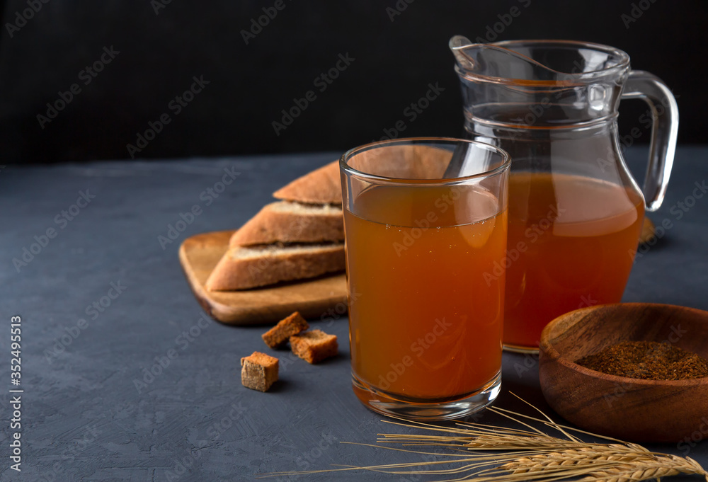 Kvass in a glass and a jug of rye bread Kvass in a glass and a jug of rye bread