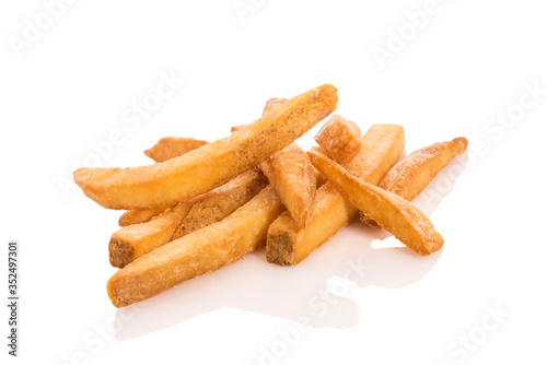 Close-up of homemade french fries with salt isolated on white background with reflection.