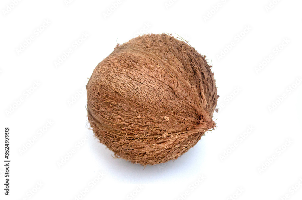 Single whole coconut isolated over the white background. Single whole coconut isolated over the white background.