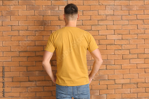 Man in stylish t-shirt near...