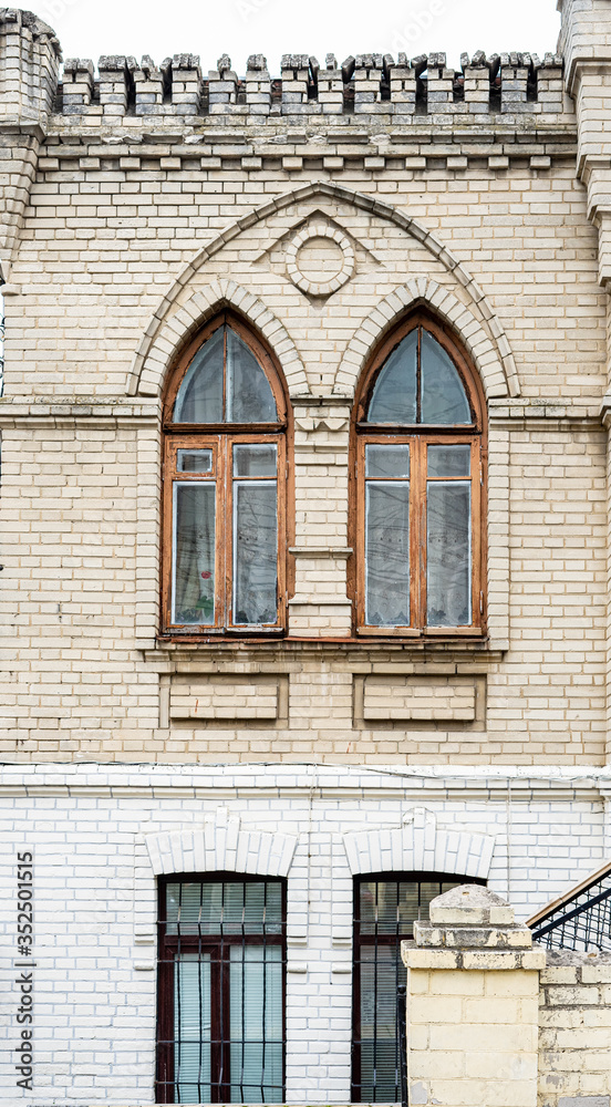 window of an old unrestored house in poor condition
