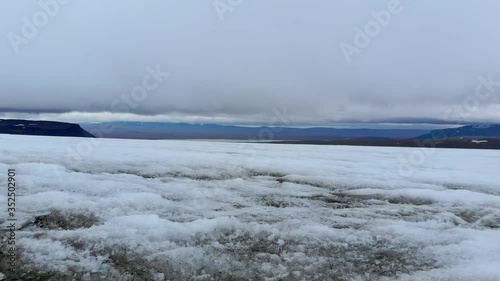 aerial shot with a glacier  in iceland melted ecology clouds 