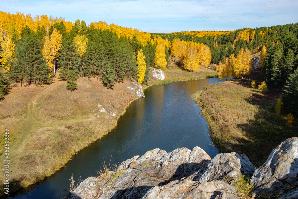 mountain view of the river and trees in autumn