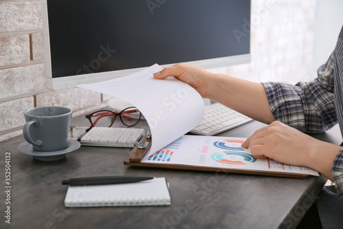 Businesswoman analyzing fin...