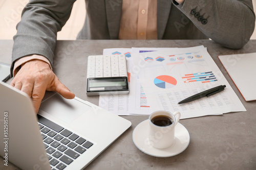 Male accountant working in ...