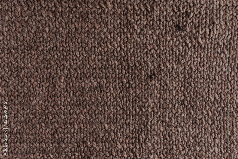 Knitted texture of brown color.