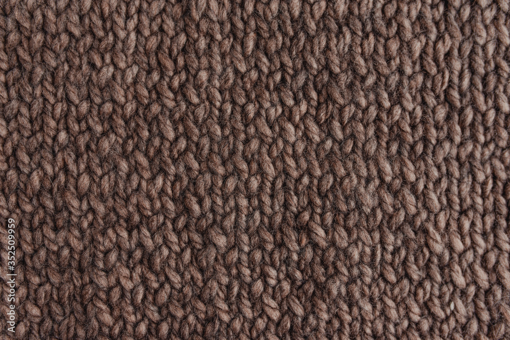 Knitted texture of brown color.