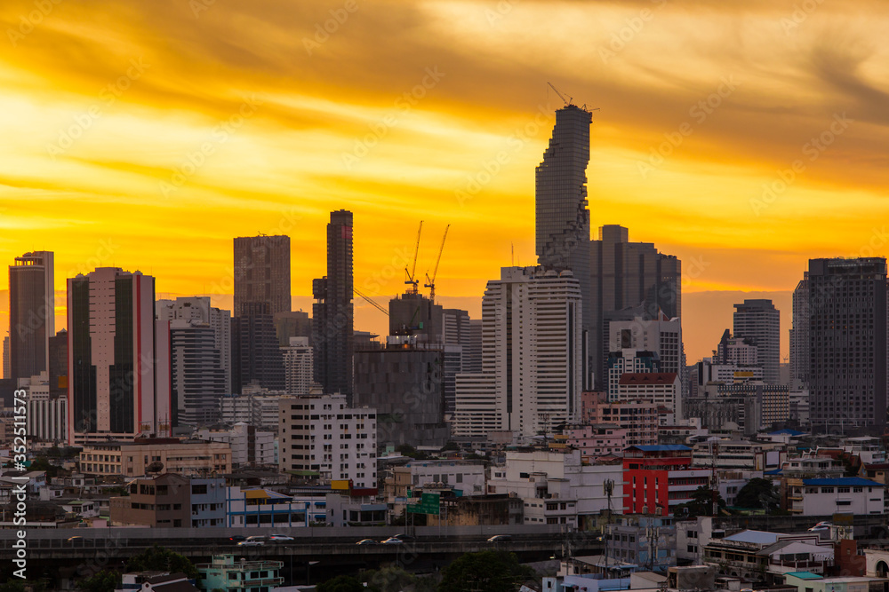 Aerial view modern office buildings in Bangkok city downtown with sunrise time