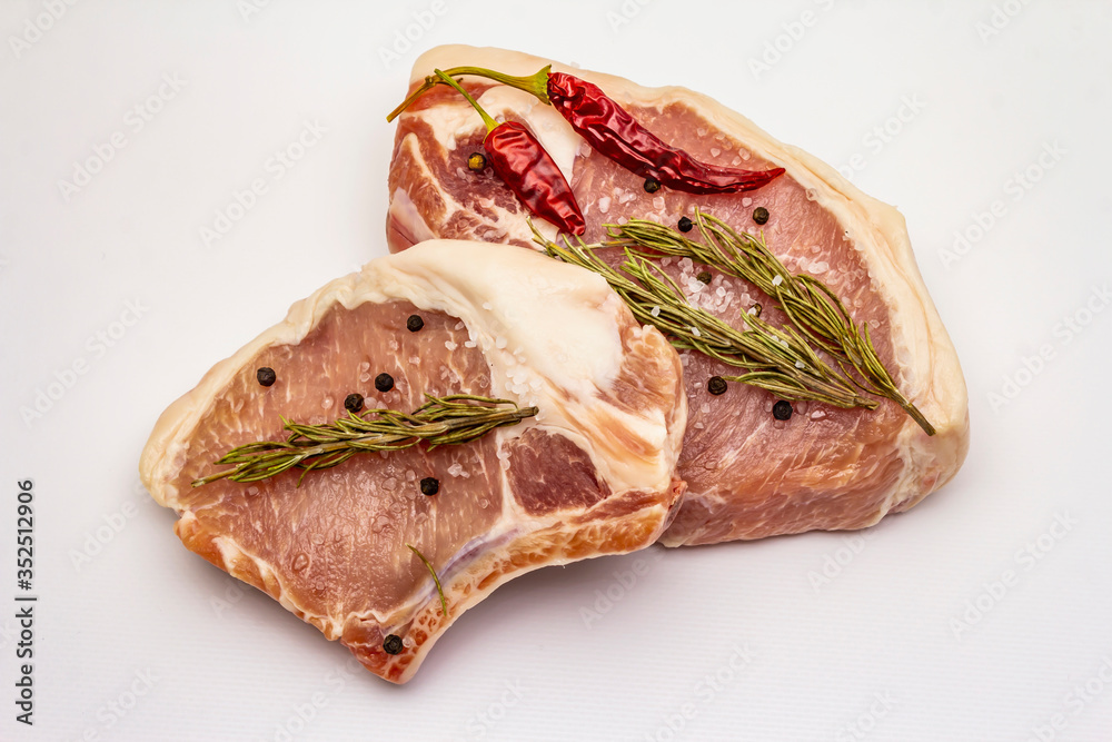 Raw pork steaks isolated on white background Raw pork steaks isolated on white background