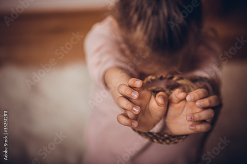 Rope on girls hand on dramatic background. International human rights or refugee day concept. The topic of freedom of speech.