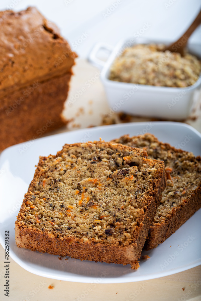 Sweet walnut carrot cake on white background