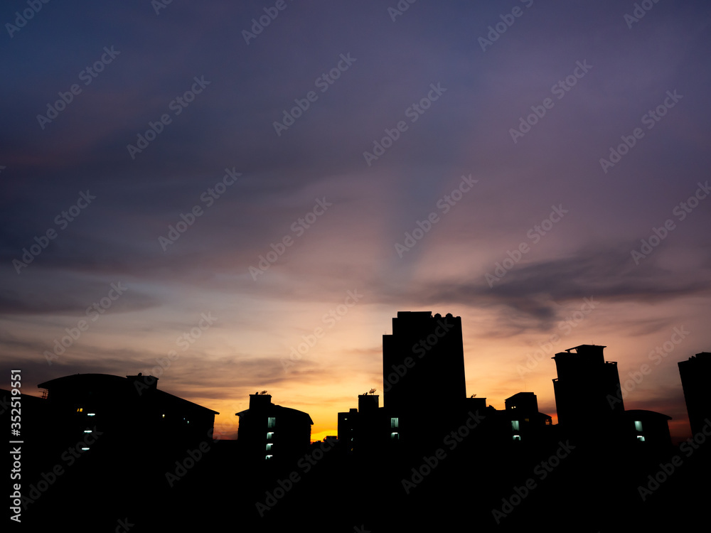 Cityscapes, night view of silhouette buildings on sunset sky background.