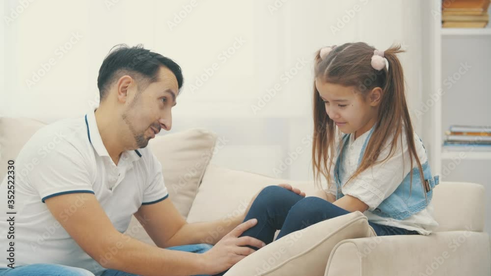 Father has a conversation with her little daughter in 4k slowmotion video. Father has a conversation with her little daughter in 4k slowmotion video.