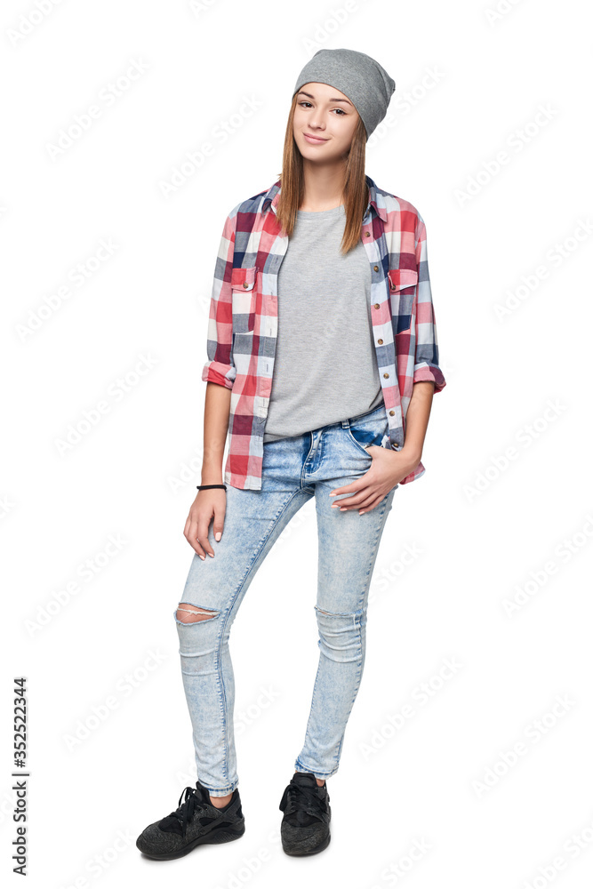 Smiling relaxed teen girl standing in full length Smiling relaxed teen girl standing in full length