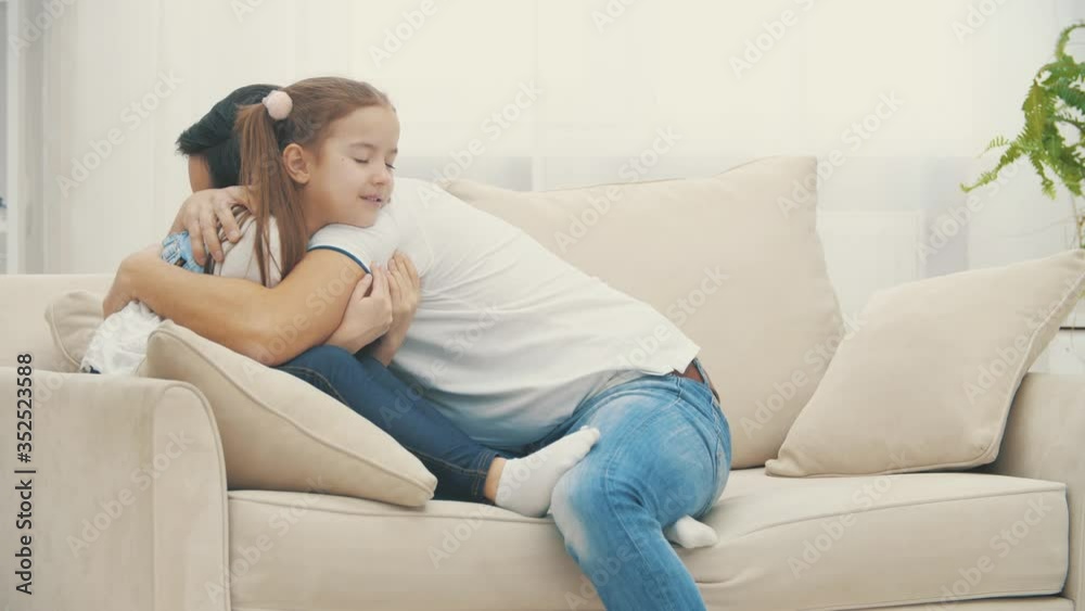 4k slowmotion video where father holding child girl in his hands and hugging each other. 4k slowmotion video where father holding child girl in his hands and hugging each other.