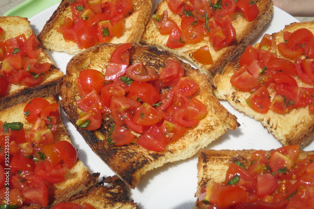 bruschetta browned bread with red cherry tomatoes