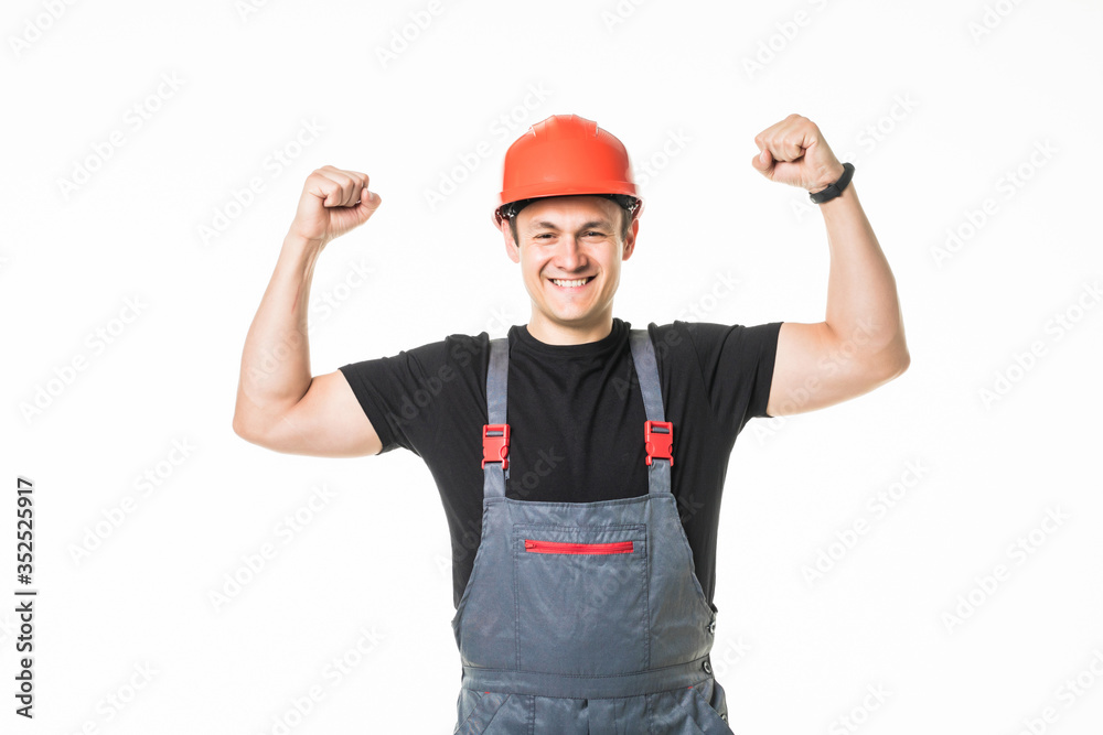 Young happy handyman arms up isolated on white background