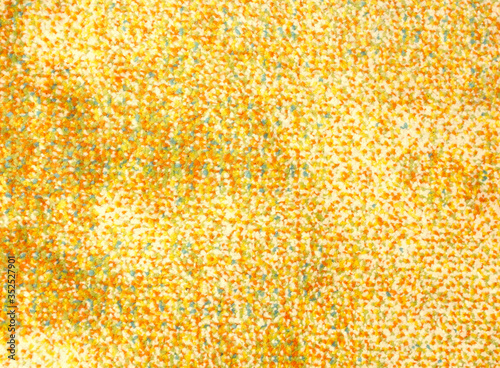 Seamless close up of monochrome yellow carpet texture background from above.